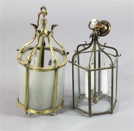 A small brass framed hanging lantern and a black painted iron hexagonal lantern